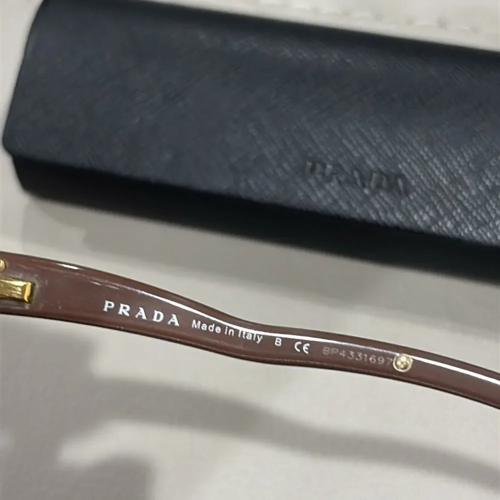 PRADA VPR06M Eyeglasses in color Hazelnut Mordore